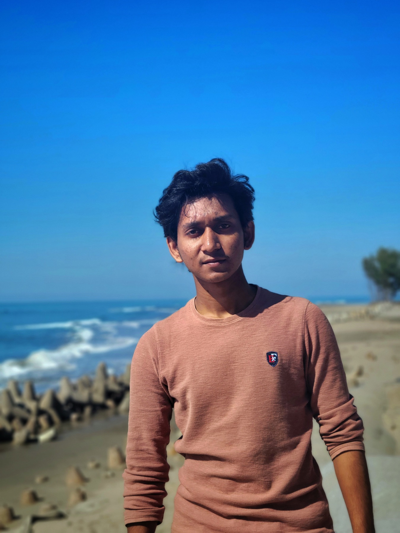 Abdul Kadir outdoors by the coast