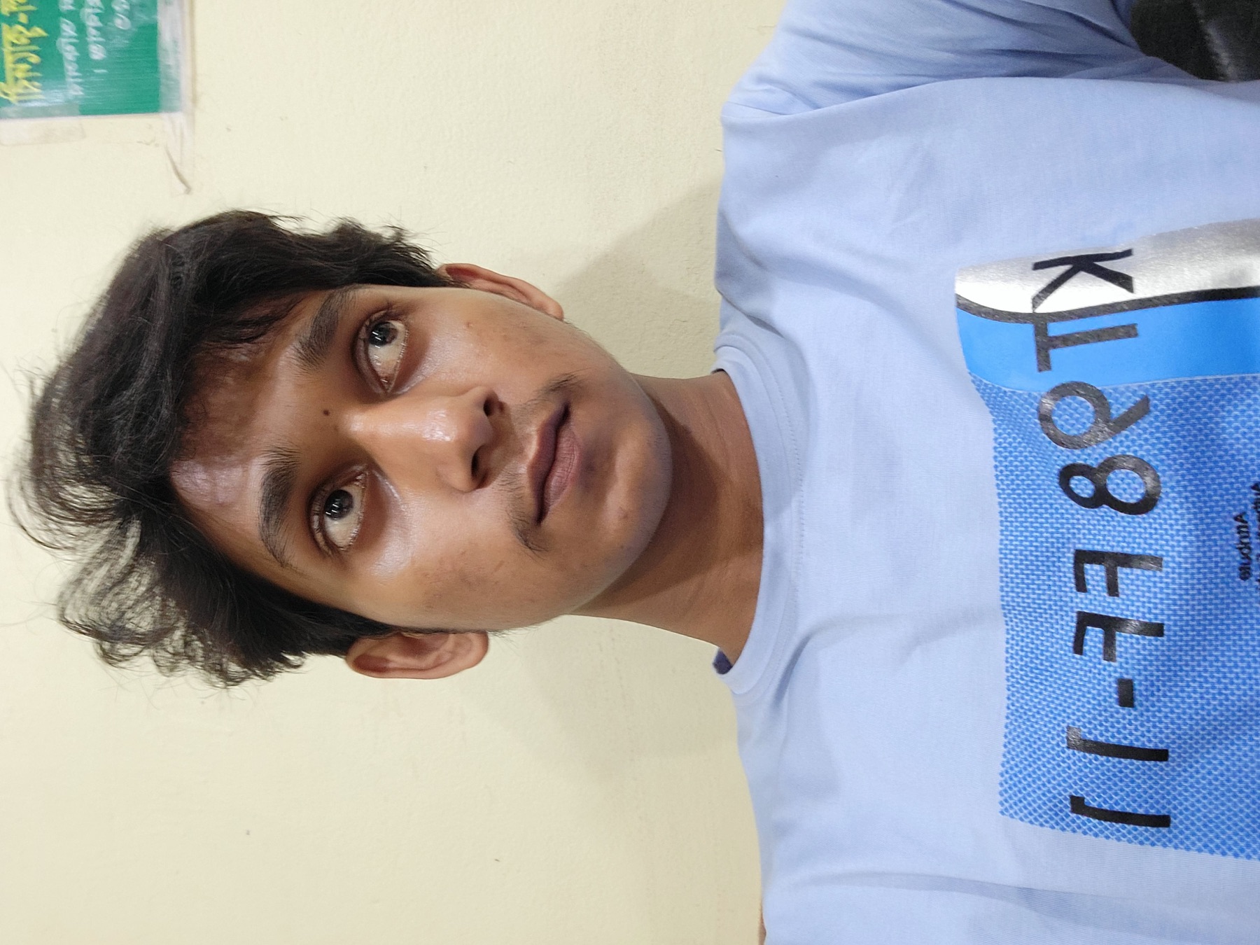 Close portrait in a light blue shirt